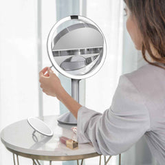 sensor mirror trio - brushed finish - lifestyle woman flipping mirror